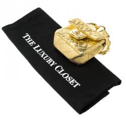 مملوكة مسبقًا حقيبة صغيرة شانيل قلاب ميني ريإيشو جلد مبطنة ميتالك ذهبية