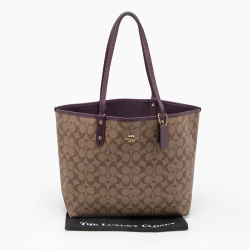 Pre Owned Coach Beige/Purple Signature Coated Canvas and Leather Reversible City Tote