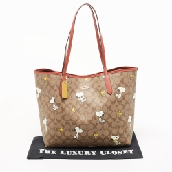 Pre Owned Coach Beige/Tan Snoopy Print Signature Coated Canvas and Leather City Shopper Tote