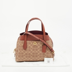 Pre Owned Coach Beige/Brown Signature Coated Canvas and Leather Lora Carryall Tote