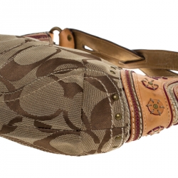 Pre Owned Coach Beige/Tan Signature Canvas and Leather Studded Mia Soho Hobo
