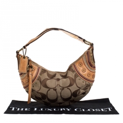 Pre Owned Coach Beige/Tan Signature Canvas and Leather Studded Mia Soho Hobo