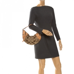 Pre Owned Coach Beige/Tan Signature Canvas and Leather Studded Mia Soho Hobo