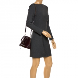 مملوكة مسبقًا حقيبة كوتش سيرا جلد عنابي لامع