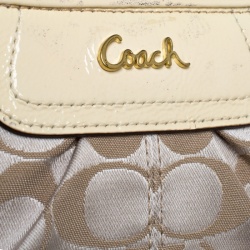Pre Owned Coach Beige Signature Canvas and Leather Wristlet Clutch