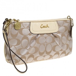 Pre Owned Coach Beige Signature Canvas and Leather Wristlet Clutch