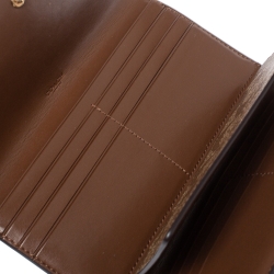Pre Owned Coach Brown Signature PVC and Leather Saddle Flap Continental Wallet