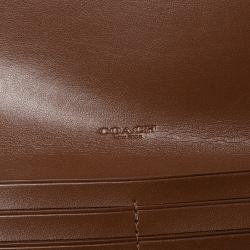 Pre Owned Coach Brown Signature PVC and Leather Saddle Flap Continental Wallet