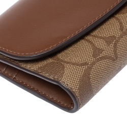 Pre Owned Coach Brown Signature PVC and Leather Saddle Flap Continental Wallet