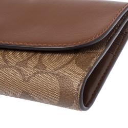 Pre Owned Coach Brown Signature PVC and Leather Saddle Flap Continental Wallet