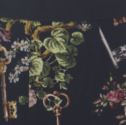 مملوكة مسبقًا تنورة دولتشي أند غابانا مطبوع مورد كريب رصاصي داكن S