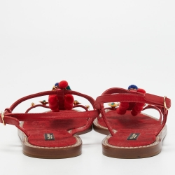 Pre Owned Dolce & Gabbana Red Leather Pom Pom and Crystal Embellished Ankle Strap Flat Sandals Size 40