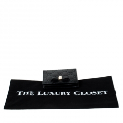 Pre Owned Gucci Black Guccissima Leather Bow Bifold Wallet