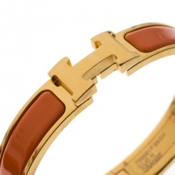 Pre Owned Hermes Clic Clac H Orange Enamel Gold Plated Narrow Bracelet GM
