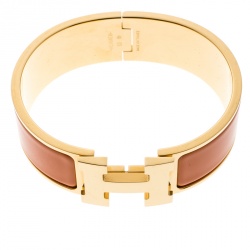 Pre Owned Hermes Clic Clac H Gold Plated Orange Enamel Bracelet