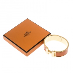 Pre Owned Hermes Clic Clac H Gold Plated Orange Enamel Bracelet