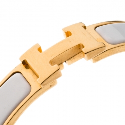 Pre Owned Hermes Clic Clac H Gold Tone White Enamel Narrow Bracelet PM