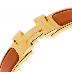 Pre Owned Hermes Clic Clac H Orange Enamel Gold Plated Narrow Bracelet PM