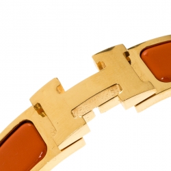 Pre Owned Hermes Clic Clac H Orange Enamel Gold Plated Narrow Bracelet PM
