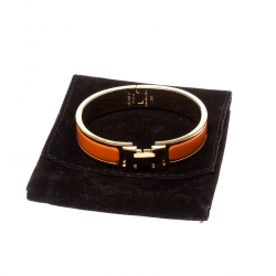 Pre Owned Hermes Clic Clac H Orange Enamel Gold Plated Narrow Bracelet PM