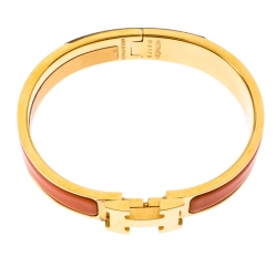 Pre Owned Hermes Clic Clac H Orange Enamel Gold Plated Narrow Bracelet PM