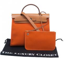 مملوكة مسبقًا Hermes Brown/Orange Canvas and Leather Herbag Zip PM Bag