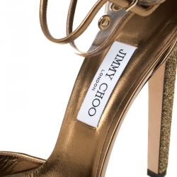 مملوكة مسبقًا Jimmy Choo Metallic Gold Lamè Fabric and PVC Mayner Peep Toe Ankle Cuff Sandals Size 41