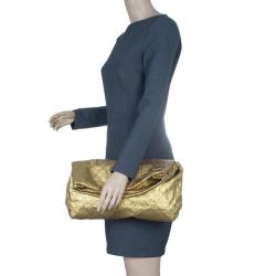 Louis Vuitton Gold Limelight MM Clutch at Jill's Consignment