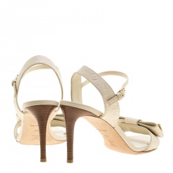 Pre Owned Louis Vuitton Beige Monogram Empreinte Leather Bow Ankle Strap Sandals Size 38