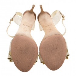 Pre Owned Louis Vuitton Beige Monogram Empreinte Leather Bow Ankle Strap Sandals Size 38