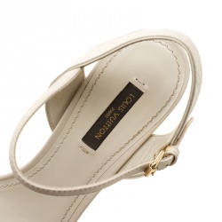 Pre Owned Louis Vuitton Beige Monogram Empreinte Leather Bow Ankle Strap Sandals Size 38