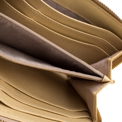 مملوكة مسبقًا Michael Kors Gold Patent Leather Jet Set Zip Around Wallet