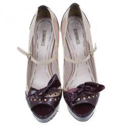 مملوكة مسبقًا حذاء كعب عالي ميوميو ماري جين فيونكة لامعة بلونين وكعب أمامي مقاس 38.5