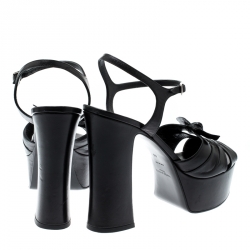 مملوكة مسبقًا صندل سان لوران باريس كاندي سير كاحل نعل سميك جلد أسود مقاس 40