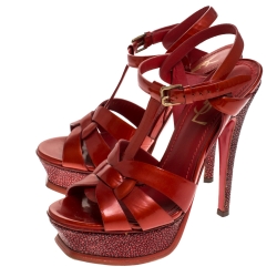 Pre Owned صندل سان لوران باريس "تريبوت" بنعل سميك بحواف سترينغراي و جلد لامع أحمر ميتاليك مقاس 35.5