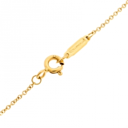 Pre Owned Tiffany & Co. Tiffany Notes Engraved 18k Yellow Gold Round Wave Pendant Necklace