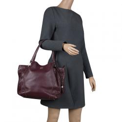 Pre Owned Tod's Burgundy Laser Cut Leather Medium Flower Tote