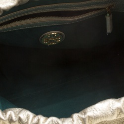 Pre Owned Tory Burch Metallic Silver Leather Perforated Logo Drawstring Tote with Pochette Accessories 