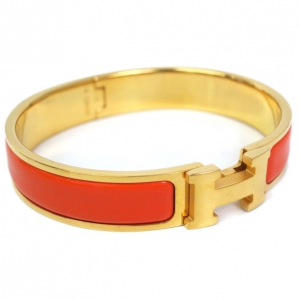 Pre Owned Hermes Clic Clac H Orange Enameled Gold Plated Bracelet