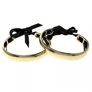 Pre Owned CH Carolina Herrera Gold Tone Ribbon Tie-up Pair of Open Cuff Bracelet