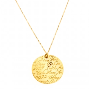 Pre Owned Tiffany & Co. Tiffany Notes Engraved 18k Yellow Gold Round Wave Pendant Necklace