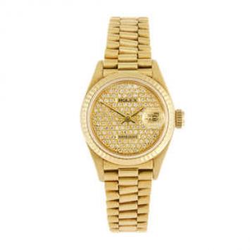 ROLEX - a ladys Oyster Perpetual Date just bracelet watch. Circa 1982. Reference 69178, serial 7610749. Signed automatic calibre 2135. Diamond set pave dial, date aperture to three. Fluted bezel, 18ct gold case fitted to an 18ct gold President bracelet wi