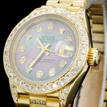 Estimated Retail Replacement Value: 50,000.00 Ref: WAG40000 Specification: Documents: Gemologist Report Model: Oyster Perpetual Date Just Movement: Perpetual, Self Winding, 31 - Jewel Chronometer Weight: 73.00 grams Case Material: 18K Yellow Gold / Set wi