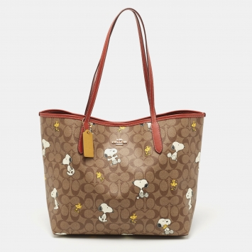 Pre Owned Coach Beige/Tan Snoopy Print Signature Coated Canvas and Leather City Shopper Tote