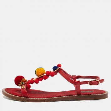 Pre Owned Dolce & Gabbana Red Leather Pom Pom and Crystal Embellished Ankle Strap Flat Sandals Size 40