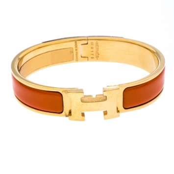 Pre Owned Hermes Clic Clac H Orange Enamel Gold Plated Narrow Bracelet PM