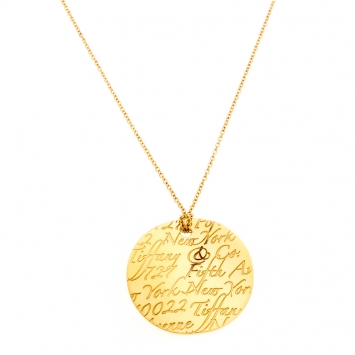 Pre Owned Tiffany & Co. Tiffany Notes Engraved 18k Yellow Gold Round Wave Pendant Necklace
