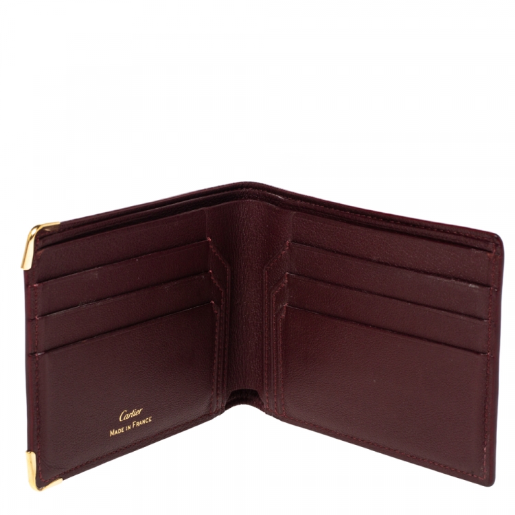 مملوكة مسبقًا Cartier Burgundy Leather Must De Cartier 6CC Bifold Wallet