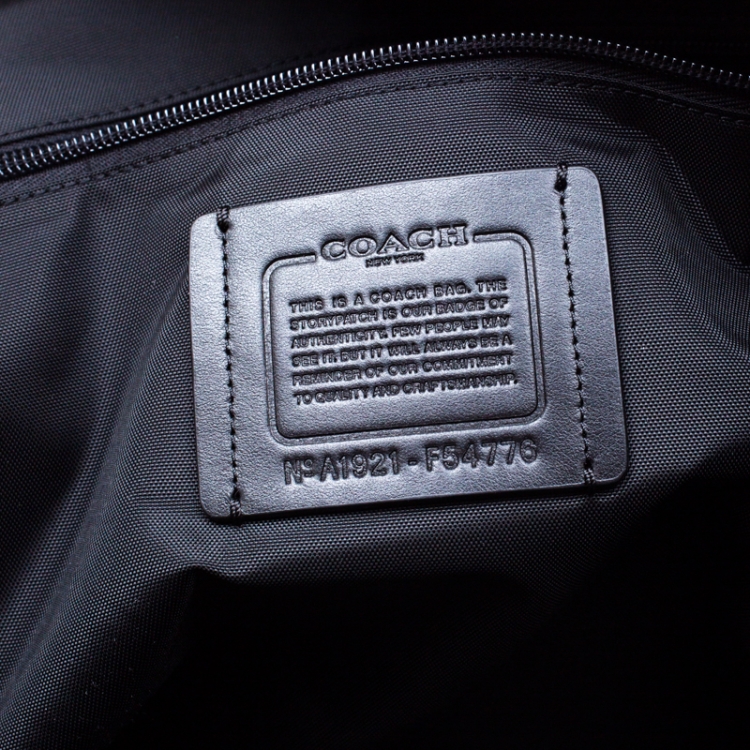 Pre Owned Coach Brown/Black Signature Coated Canvas Metropolitan Duffle Bag