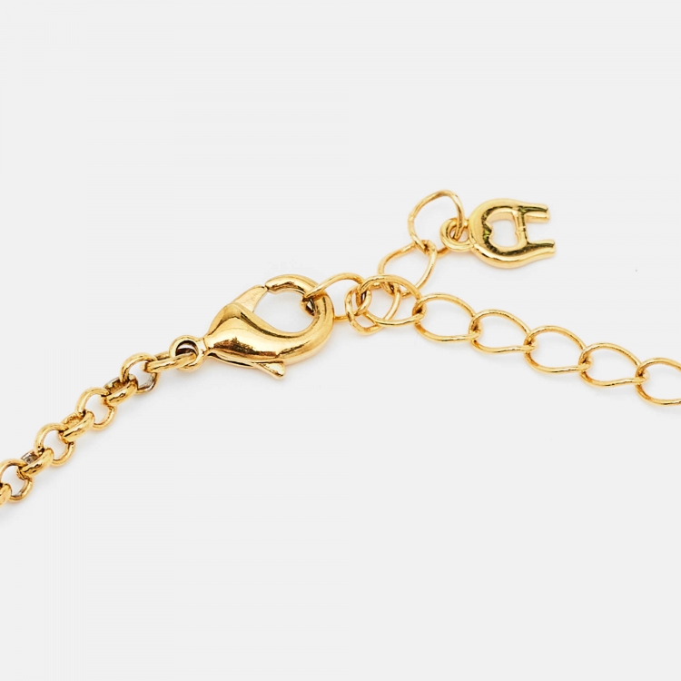 Pre Owned Aigner Gold Tone Mother of Pearl Crystal Logo Pendant Necklace